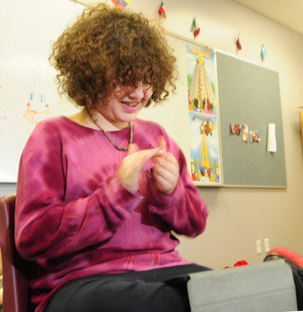 Hour of CODE: acek Twarog, a sixth-grader from Fayette, claps as he plays a program that he coded in the Hopscotch app on an iPad on Friday at Maranacook Middle School in Readfield.