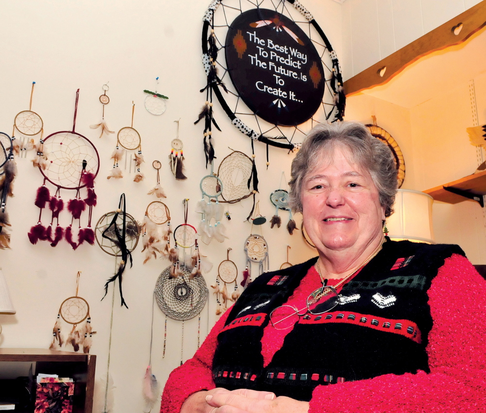 DREAM MAKER: Surrounded by a wall of dream catchers, REM Executive Director Faye Nicholson speaks about her 18 years at the organization in Waterville.