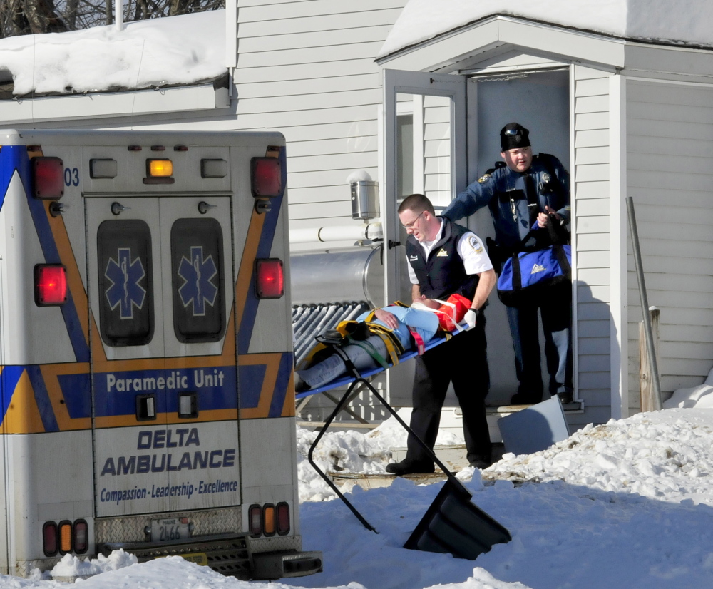 CLOSE CALL: Police say this woman was transported to a hospital as a precaution after she fled a nearby home on the Horseback Road in Clinton after a man threatened her with a gun on Sunday, Jan. 5, 2014.