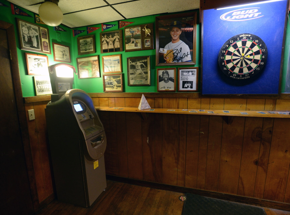 An ATM, left, is available for customer use Tuesday at the Griffin Club in South Portland. The EBT data released by the state Tuesday did not specify whether transactions were purchases or ATM withdrawals.