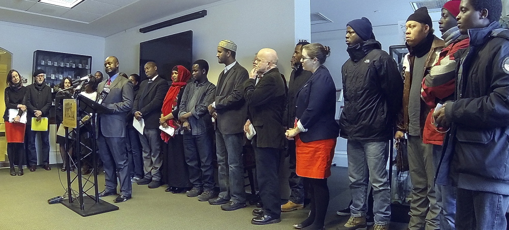 Dozens of Mainers address media and state officials Friday at the State House Welcome Center in Augusta. Immigrants, attorneys, religious leaders and advocates for the poor spoke in opposition to a proposed change to General Assistance.