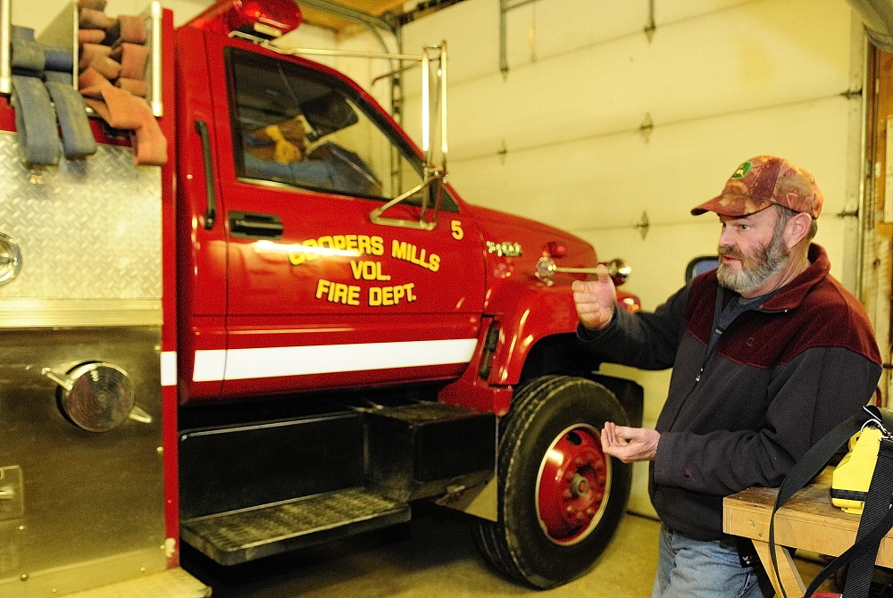 Staff photo by Joe Phelan Whitefield Fire Chief Scott Higgins talks about the department's 1993 pumper during an interview on Friday January 17, 2014 in Coopers Mills Fire Station. There are plans to replace both it and another truck with one new truck.