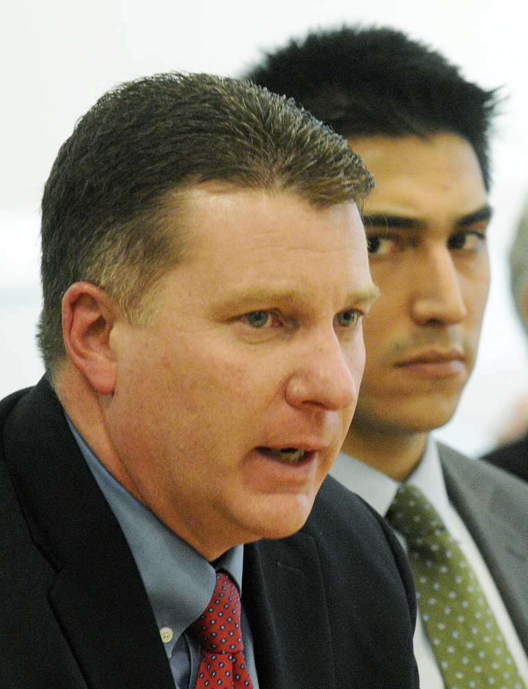 Patrick Keliher, Commissioner of the Maine Department of Marine Resources, left, addresses the Marine Resources Committee on Wednesday, Jan. 29, 2014 in Augusta as Attorney Michael-Corey Hinton, representing Native American elver fisherman, listens to the testimony.