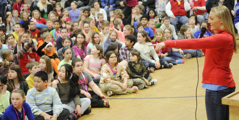 Achievement: Olympic luger Julia Clukey talks to students about goal setting during a medal ceremony for academic test scores on Thursday at Farrington School in Augusta.