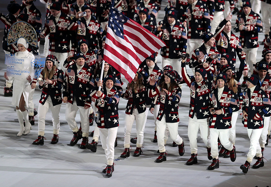 Todd Lodwick of the United States carries his country flag as the team arrives during the opening ceremony of the 2014 Winter Olympics in Sochi, Russia, on Friday.