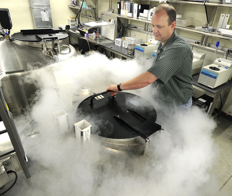 Dr. Rob Taft closes a liquid nitrogen tank containing several hundred thousand mice embryos at Jackson Labs in Bar Harbor in 2011. Maine lawmakers are considering a $73 million bond package that would target investment in the state’s biotechnology and marine sectors, and Jackson Labs is one of many companies that could benefit.