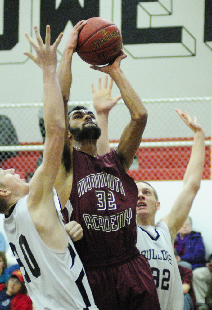 GOING PLACES: Monmouth Academy’s Marcques Houston, center, averaged 13 points and nearly 7 rebounds per game this season. Houston will play in Saturday’s McDonald’s Senior All-Star game at Husson College in Bangor.