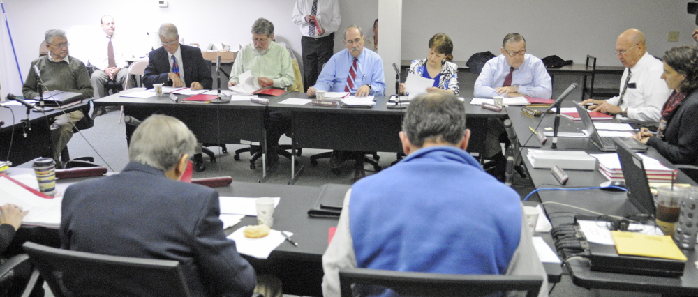 Russ Edwards, owner of the Meadowbrook Trailer Park in Richmond, far left, speaks during a hearing on Wednesday before the The Manufactured Housing Board in Gardiner.