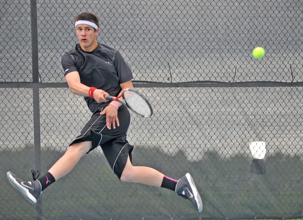 Tennis: Monmouth Academy’s Kasey Smith returns a shot from Waterville Senior High School’s Zack Disch at the Round of 48 singles tournament hosted by Colby College in Waterville on Saturday. Disch defeated Smith, 3-6, 6-3, 6-3.