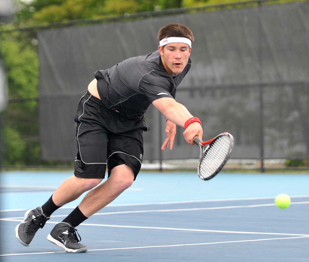 Dive: Monmouth Academy’s Kasey Smith tries to returns a shot from Waterville Senior High School’s Zack Disch at the Round of 48 singles tournament hosted by Colby College in Waterville on Saturday. Disch defeated Smith, 3-6, 6-3, 6-3.