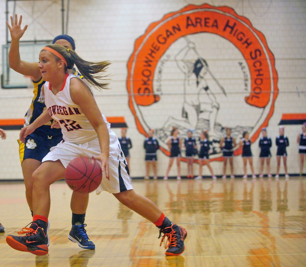 Mascot Change: The Skowhegan Area High School Indian mascot is emblazoned on the wall of the gymnasium during a game against Mt. Blue High School in Skowhegan in December 2013.