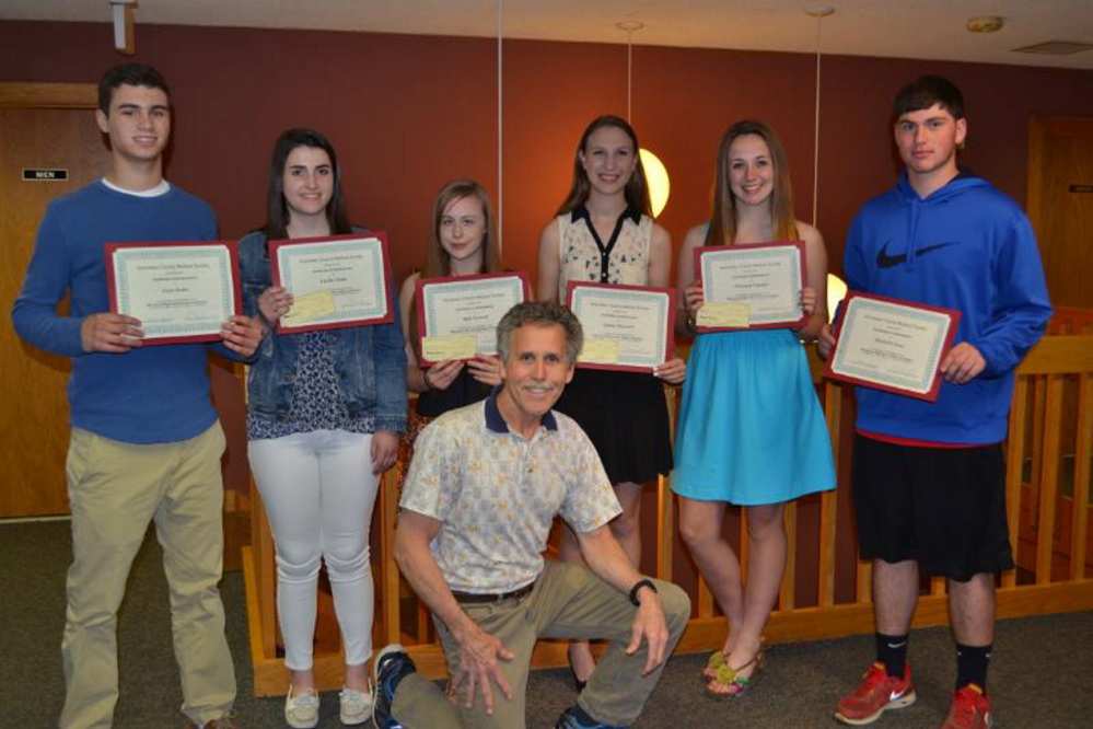 From left are Liam Stokes, Amelia Trudo, Dale Varnum, Sydney Sansouci, Christina Claudel and Mitchell Caron. Front is teacher Tom Wells.