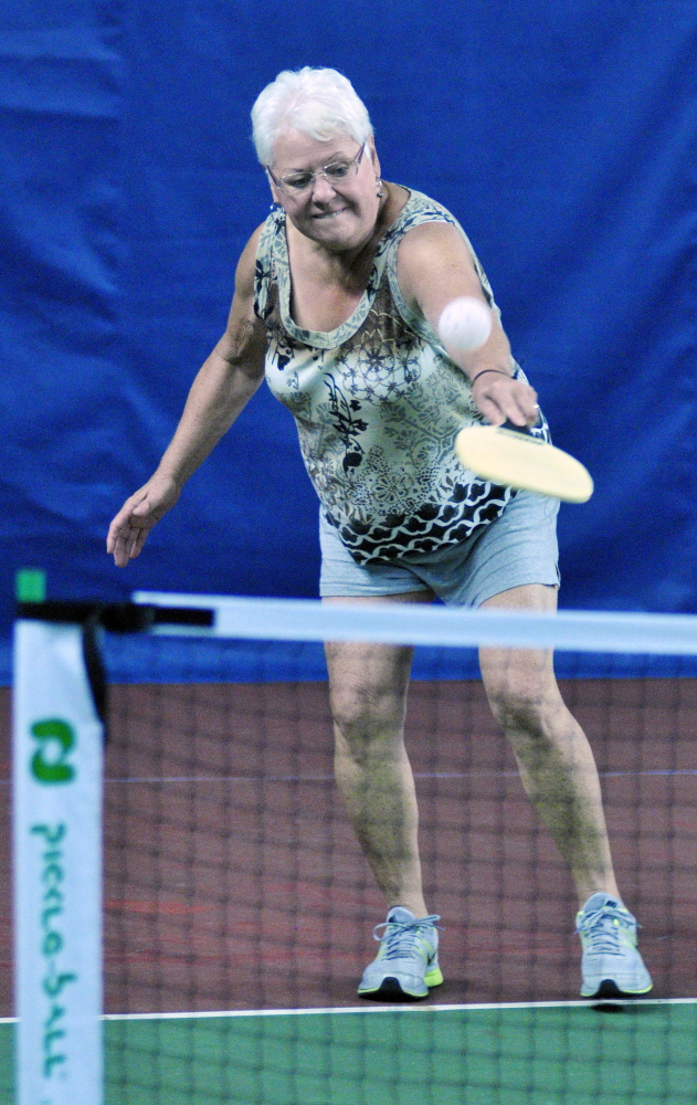 Carol Jowdry returns a shot during a pickleball clinic on Saturday at A-COPI Tennis and Sports Center in Augusta.