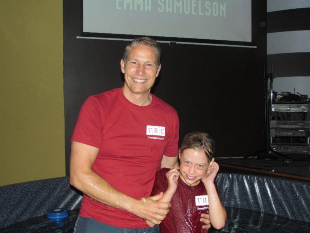 Pastor Eric Samuelson with his daughter Emma after she was baptized