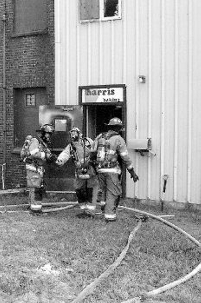 Firefighters enter the Harris Bakery Co. building at  1 Harris st. in August 2009. The arson fire added to the building’s decay.