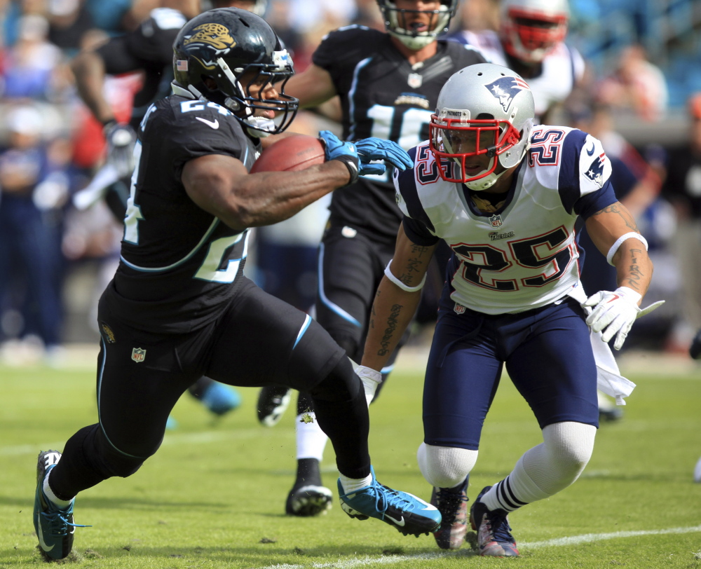 New England Patriots defensive back Patrick Chung, right, is fighting for playing time at the safety position next to starter Devin McCourty. Chung will be fighting for time with Duron Harmon and Tavon Wilson.