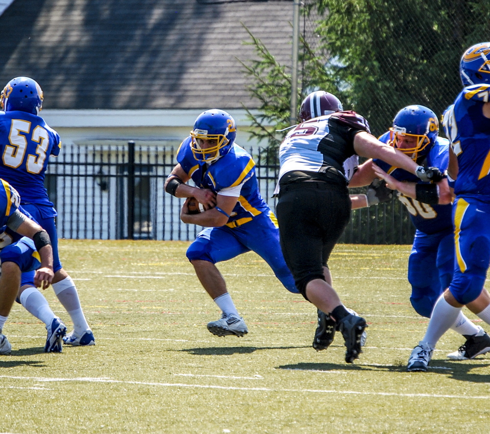 Contributed photo by Tim Koster/Maine Maritime Academy 
 Josh Doolan helps lead a balanced Maine Maritime Academy backfield with his brother, Jake. Josh Doolan rushed for 67 yards in a season-opening victory over Anna Maria last weekend.