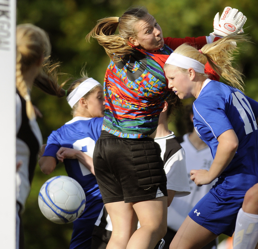 Staff photo by Andy Molloy
Madison forward Madeline Wood heads the ball past Hall-Dale keeper Olivia Maynard and into the back of the net during a Mountain Valley Conference game Thursday in Farmingdale.