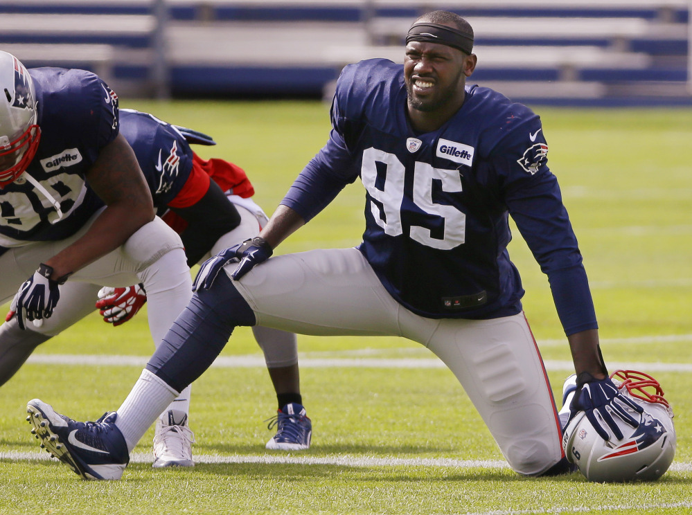 New England Patriots defensive end Chandler Jones (95) stretches before practice begins at the team’s facility Wednesday in Foxborough, Mass. The Patriots will play the Kansas City Chiefs Monday night in Kansas City.