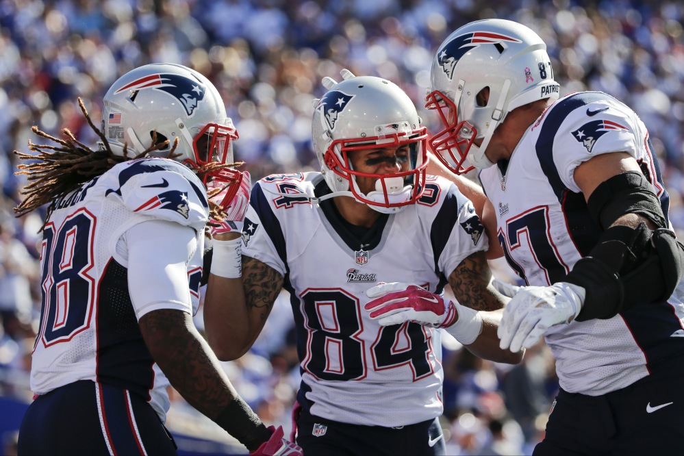 Brian Tyms of the Patriots celebrates a touchdown catch with teammate James Develin in the second quarter of Sunday’s game against the Buffalo Bills at Orchard Park, N.Y.