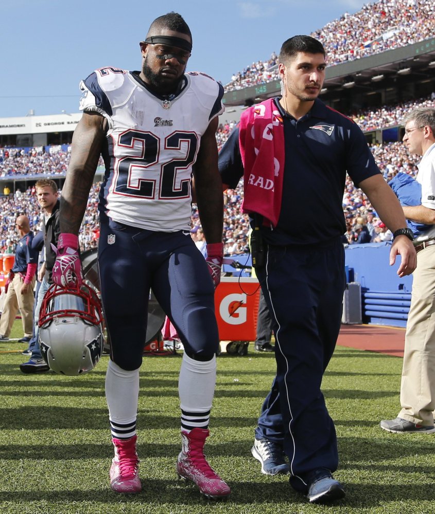 New England Patriots running back Stevan Ridley (22) is helped off the field during the second half Sunday against the Buffalo Bills in Orchard Park, N.Y. Ridley suffered a knee injury and is out of Thursday’s game against the New York Jets.