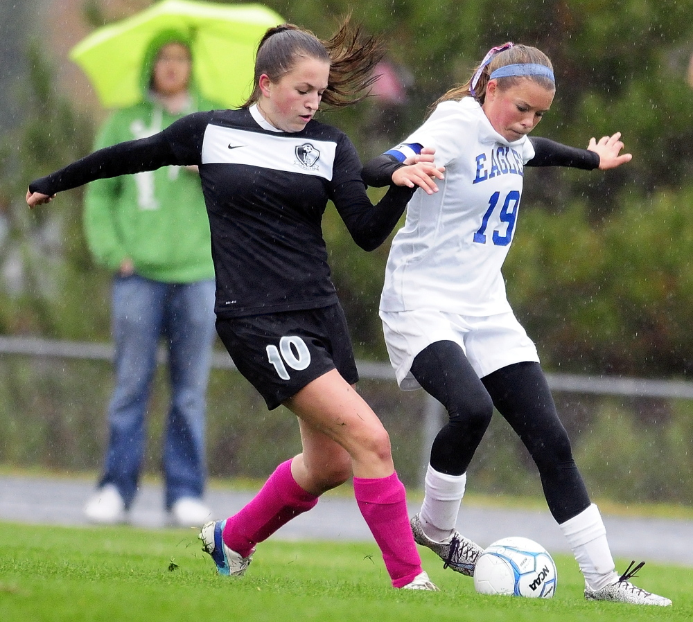 Lincoln Academy forward Leslie Sandefur, left, and Erskine Academy midfielder Avery Bond battle for a ball during a game Tuesday in South China. Erskine won 3-1.