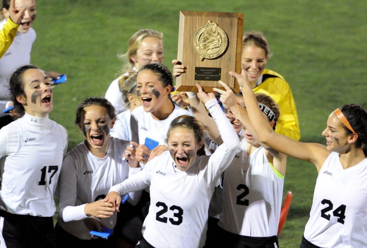 Skowhegan Area High School celebrates their 2-0 win over Lawrence High School in the Eastern Class A title game Thursday at Hampden Academy.