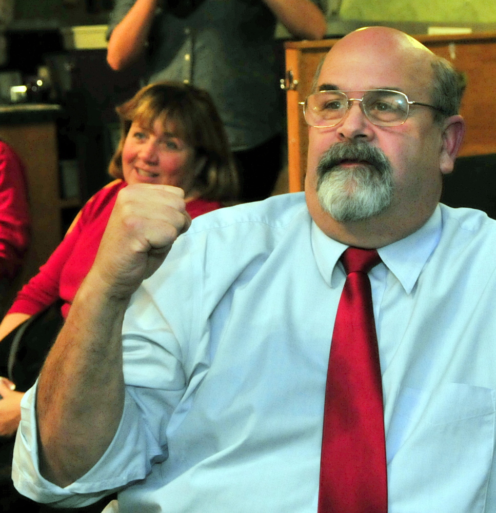 Augusta mayoral candidate Dave Rollins celebrates as election results come in Tuesday at Lisa’s Restaurant and Catering in Augusta. Rollins won the election.