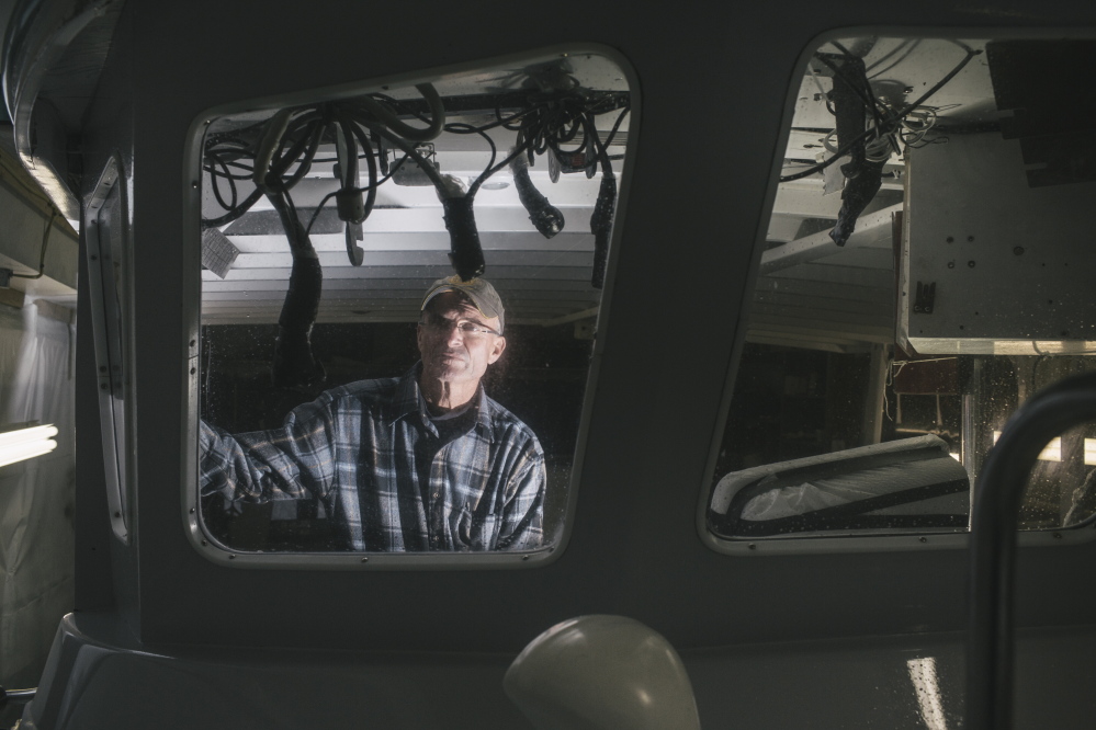 Tim Tower stands on his boat Wednesday in York. Tower uses the boat to charter recreational deep-sea fishing trips. Additional federal fishing regulations have been put on cod, prohibiting recreational fishermen from keeping any cod they catch.