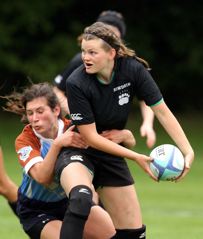 Hayleigh Kein looks to toss the ball during a recent rugby match for Bowdoin College.