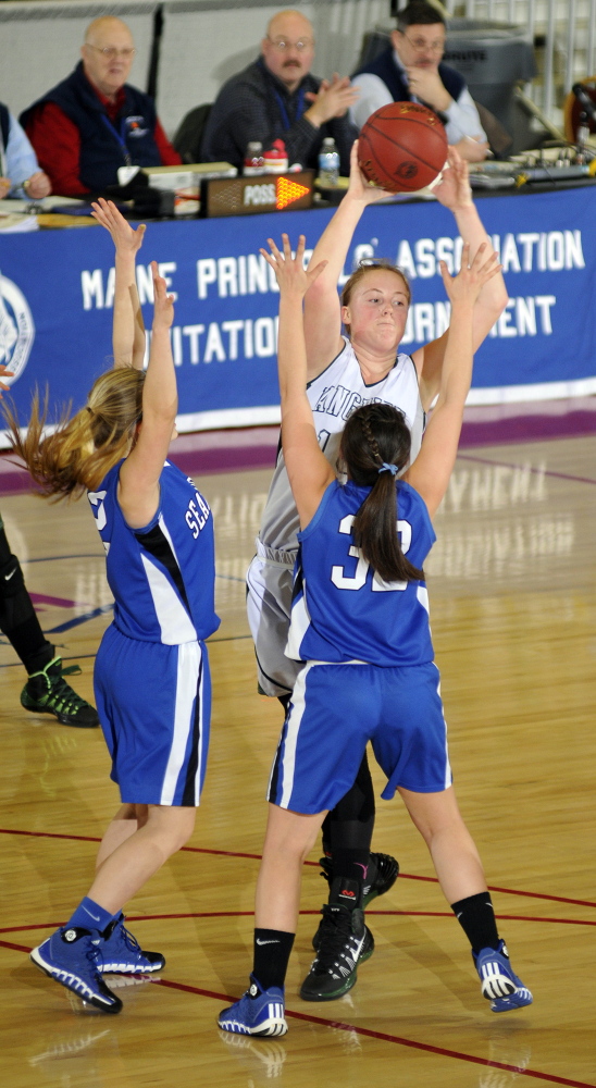 Rangeley center Taylor Esty draws a few Searsport defenders during a western D tournament game last year. Esty reached the 1,000 mark of her career Tuesday night.