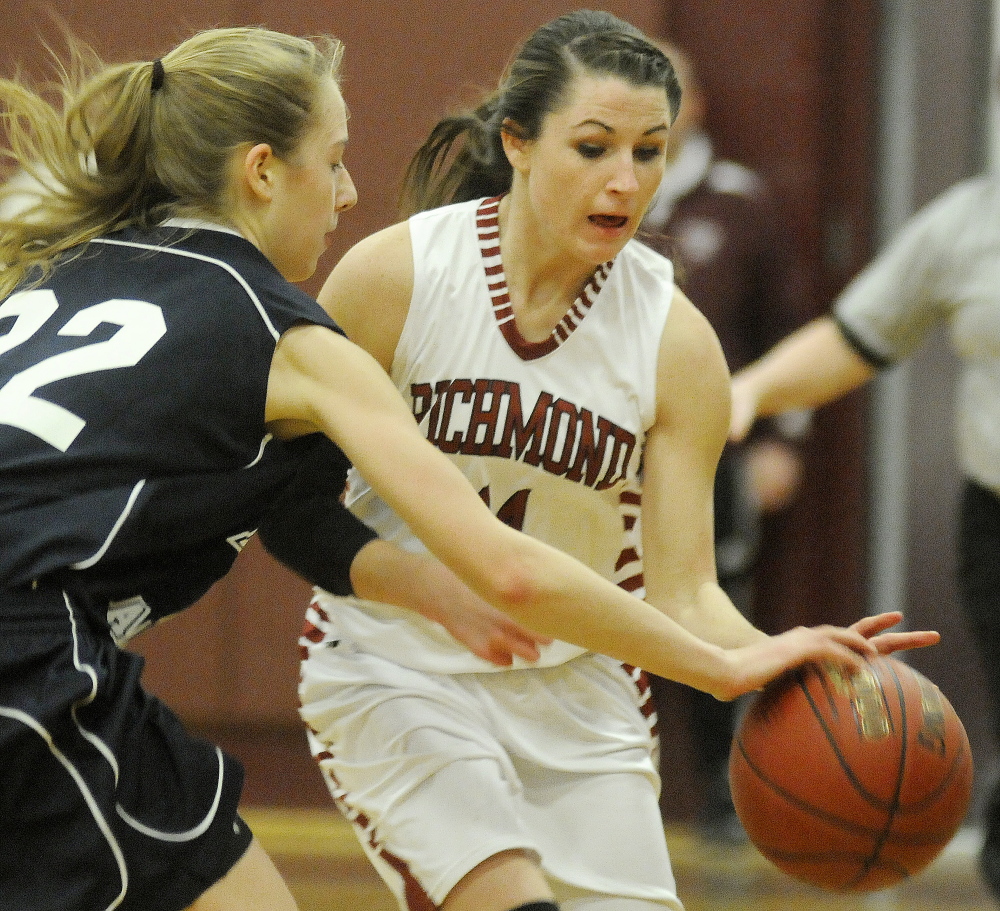 Richmond High School’s Meranda Martin, right, attempts to dribble around Pine Tree Academy’s Alex Goodman during Wednesday’s game in Richmond.