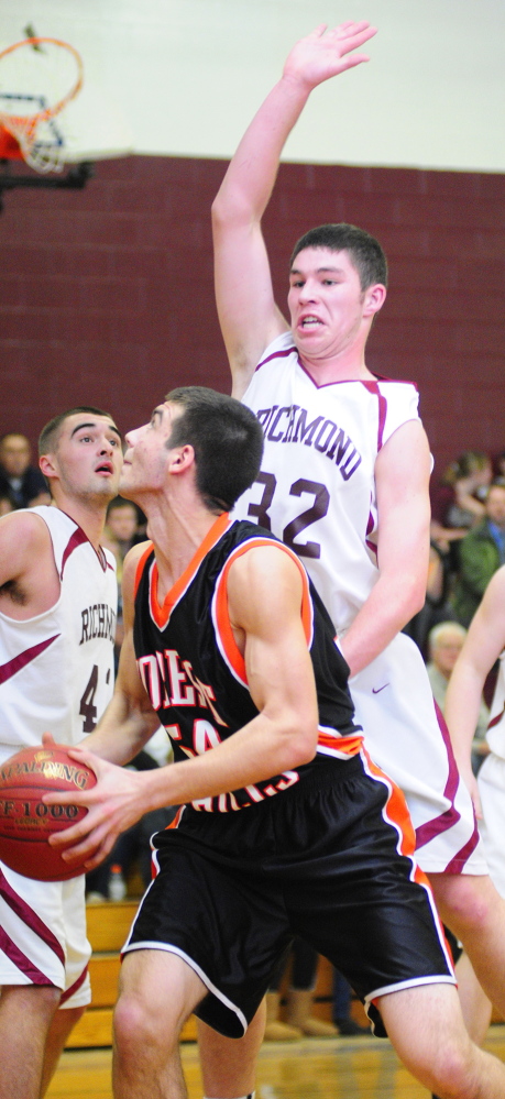 Staff file photo by Joe Phelan 
 Forest Hills center Tanner Daigle tries to shoot during a game against Richmond last season. Daigle, now a senior, is a big reason the Tigers are undefeated this season.