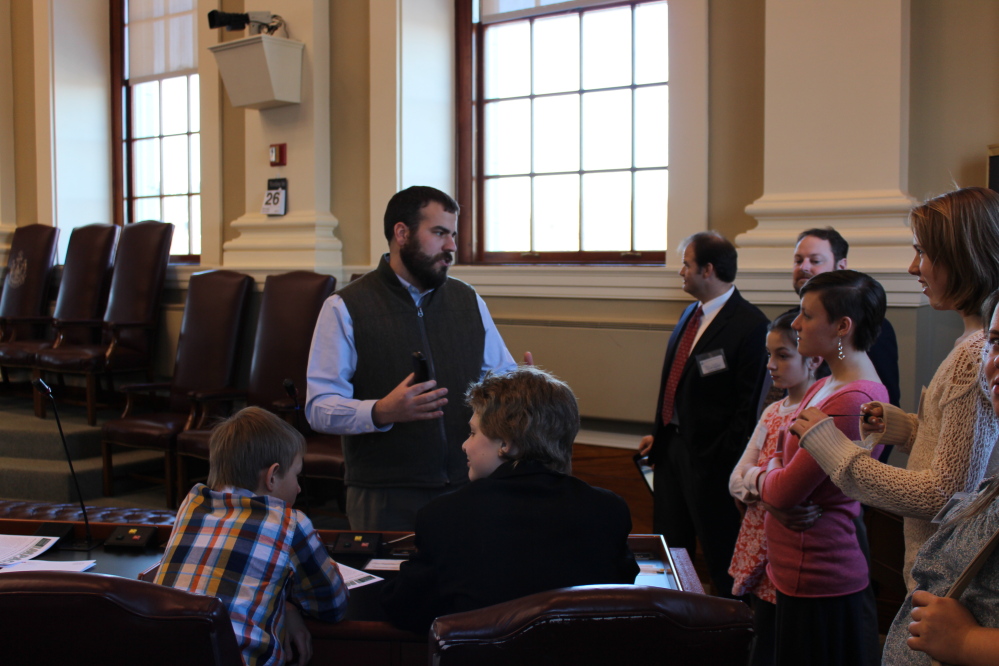 CAP.cutline_standalone:House Majority Leader Jeff McCabe, D-Skowhegan, from left, standing, recently greeted students from Cornville Regional Charter School. The students toured the State House in Augusta and then had the chance to ask McCabe questions about the legislative process.