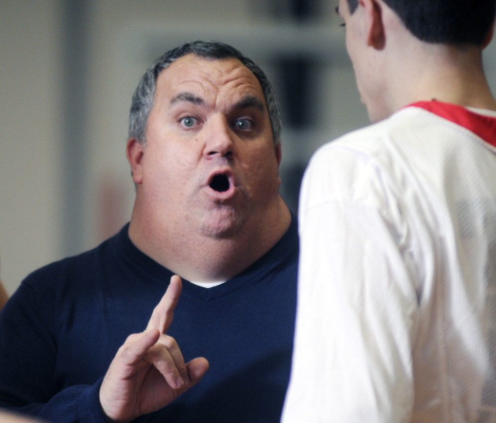 Cony boys basketball coach T.J. Maines addresses his team during a timeout in a game against Edward Little on Feb. 3. The Rams had their Eastern A quarterfinal against Lewiston pushed from Saturday to Monday because of the latest winter storm.