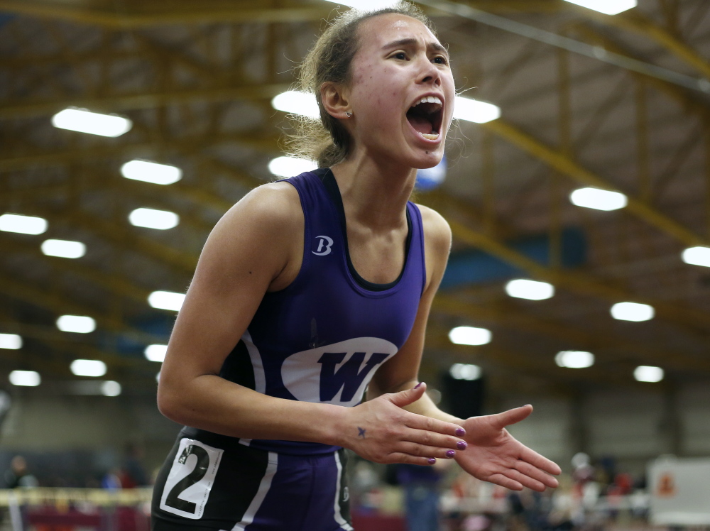 Cecilia Morin of Waterville cheers on her teammates after finishing her leg of the 4x800 relay Mondayu during the Class B indoor track and field championship meet.