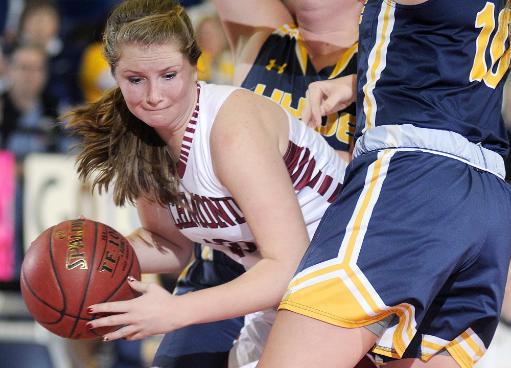 Richmond High School’s Kelsea Anair is sandwiched by Hyde defender during a Western D quarterfinal game Tuesday morning at the Augusta Civic Center.