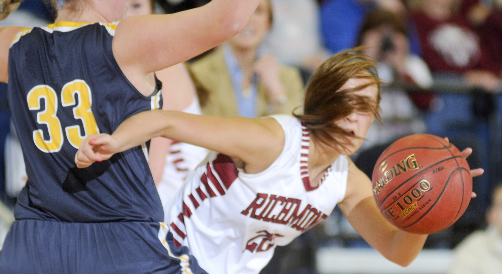 Richmond High School’s Autumn Acord dribbles around Hyde School’s Emma Levensohn during a Western D quarterfinal game Tuesday morning at the Augusta Civic Center.