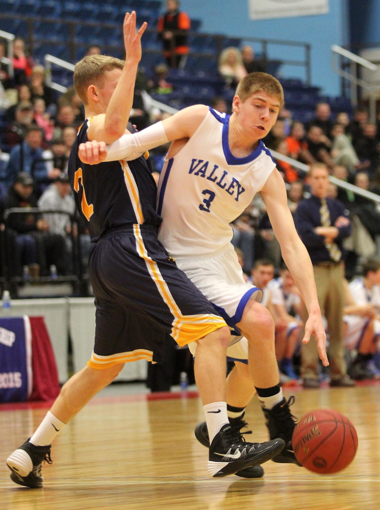 Valley High School’s Cody Laweryson tries to dribble around Hyde School’s Keifer Cundy during the first half of the Cavaliers’ 61-47 loss in a Western Class D semifinal game at the Augusta Civic on Wednesday.