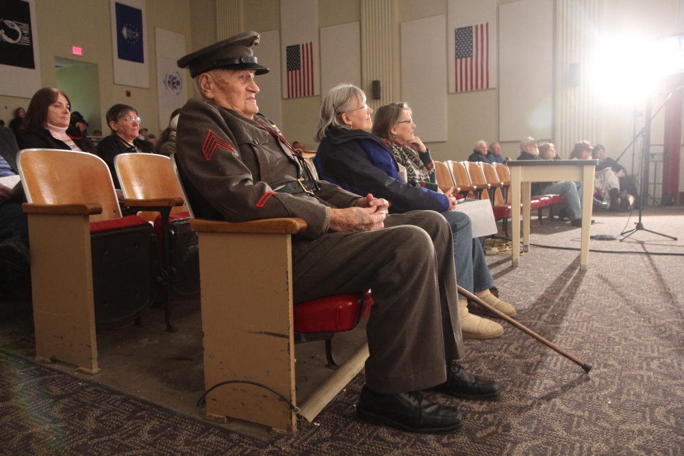 Leroy Peasley Sr., 91, listens to The Windy Ridge Band in his Marine Corps dress uniform Saturday at the 2015 Creative Arts Festival at the Togus veterans hospital in Augusta. Peasley served with the Marines on Iwo Jima in World War II.