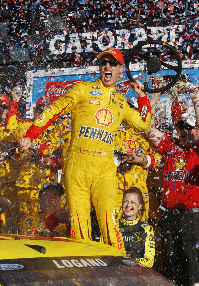 Joey Logano celebrates in Victory Lane after winning the Daytona 500 on Sunday at Daytona International Speedway in Daytona Beach, Fla.