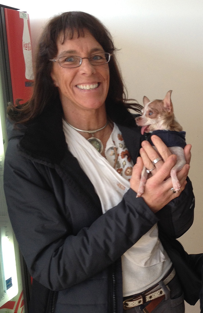 Laurie Randall, of Farmingdale, and Benjamin, her service animal, stand outside the Maine Human Rights Commission hearing room on Monday. The commission voted against finding she was a victim of discrimination in housing.