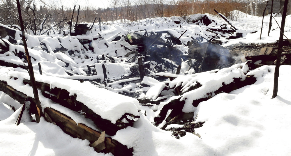 Smoke was still rising Sunday from the ruins of an unoccupied home in St. Albans that burned Saturday afternoon. Fire investigators have ruled that the fire was intentionally set.