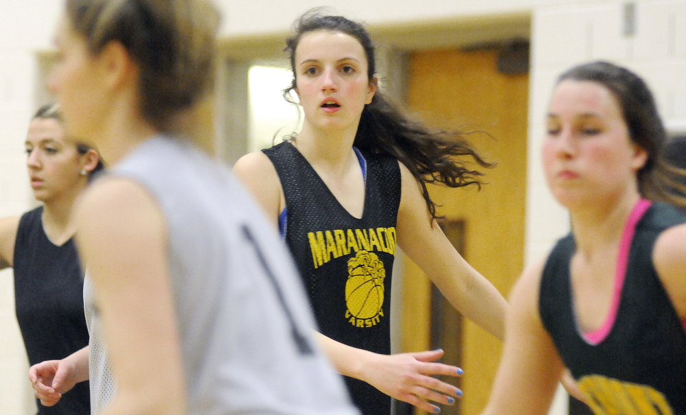 Maranacook Community High School’s Elizabeth D’Angelo, center, practices Wednesday in Readfield.