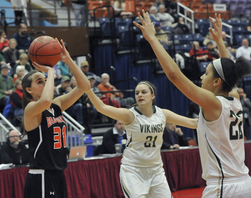 Brunswick’s Madeline Suhr shoots as Jayden Colby, center, and Tiana Sugars of Oxford Hills defend. Suhr finished with 11 points.