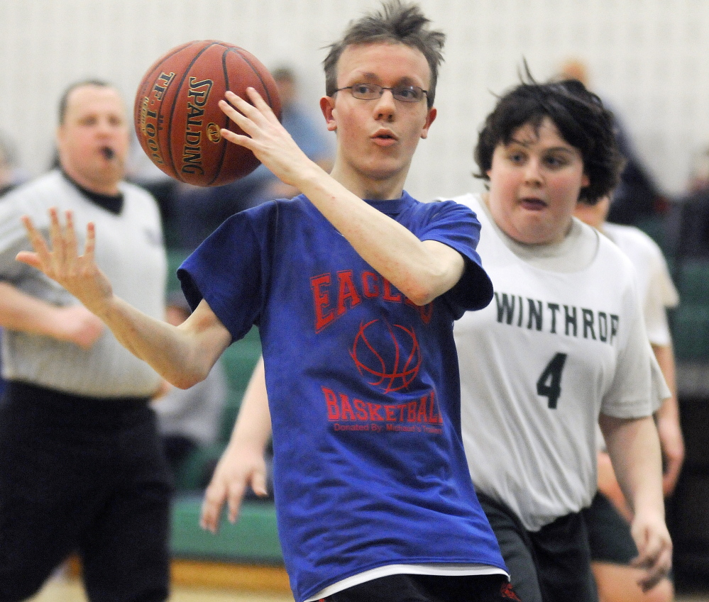 Messalonksee’s R.J. Preo grabs a rebound as Winthrop’s Dillion Coston closes in during a Unified quarterfinal Tuesday afternoon in Winthrop. The Ramblers prevailed 55-50.