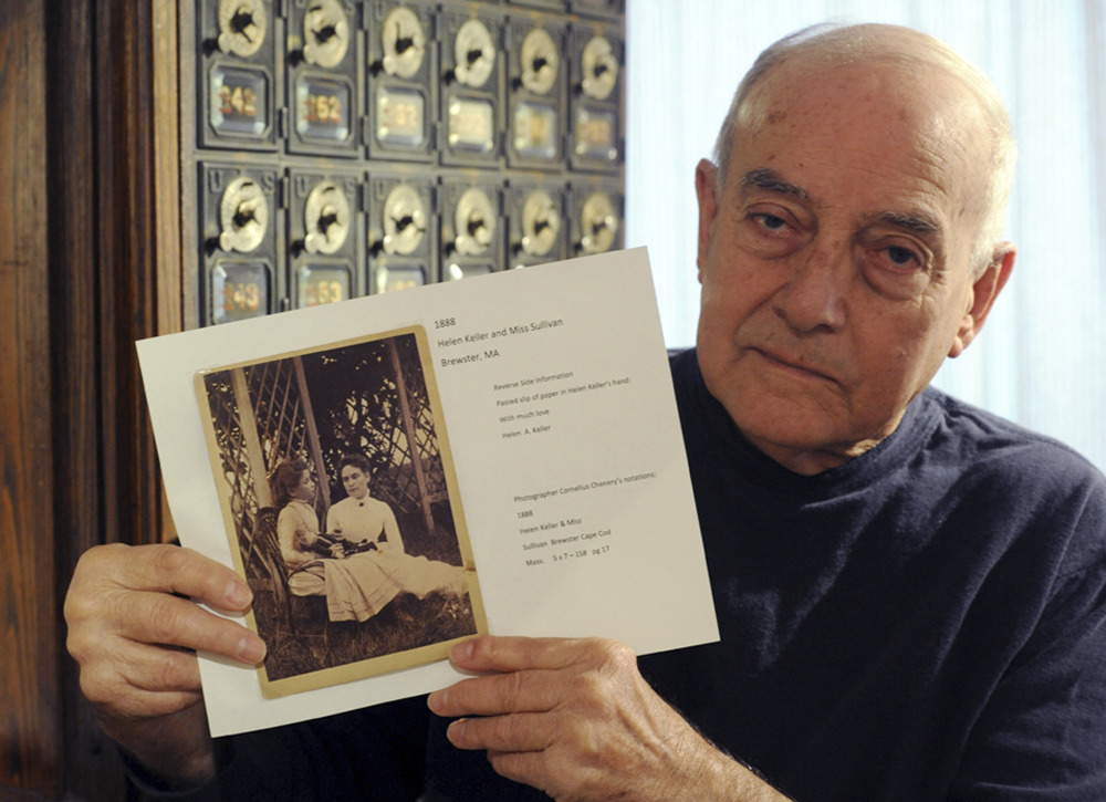 Thomas Slezak, manager of the Brewster Historical Society Museum, holds this rare photo of Helen Keller and her teacher, Anne Sullivan, that was donated to the museum in Brewster, Mass. The photo shows Keller and her teacher, Sullivan, in Brewster, where they took many summer vacations.