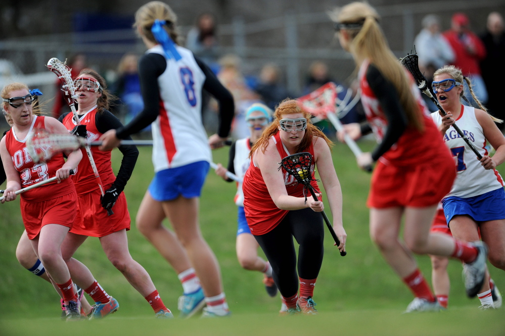 Cony’s Becca Coniff (36) scoops up the ball in the second period against Messalonskee on Tuesday in Oakland.