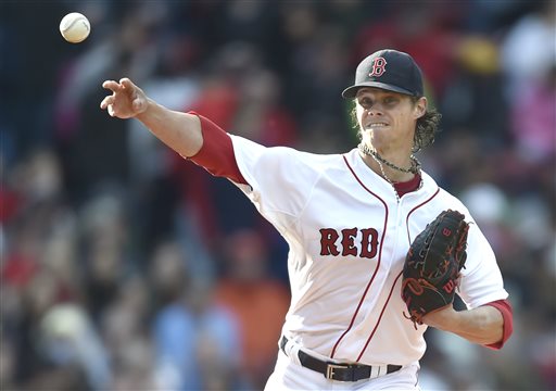 Red Sox starting pitcher Clay Buchholz throws to first in an attempted pickoff in the fourth inning against the Orioles on Saturday. The Associated Press