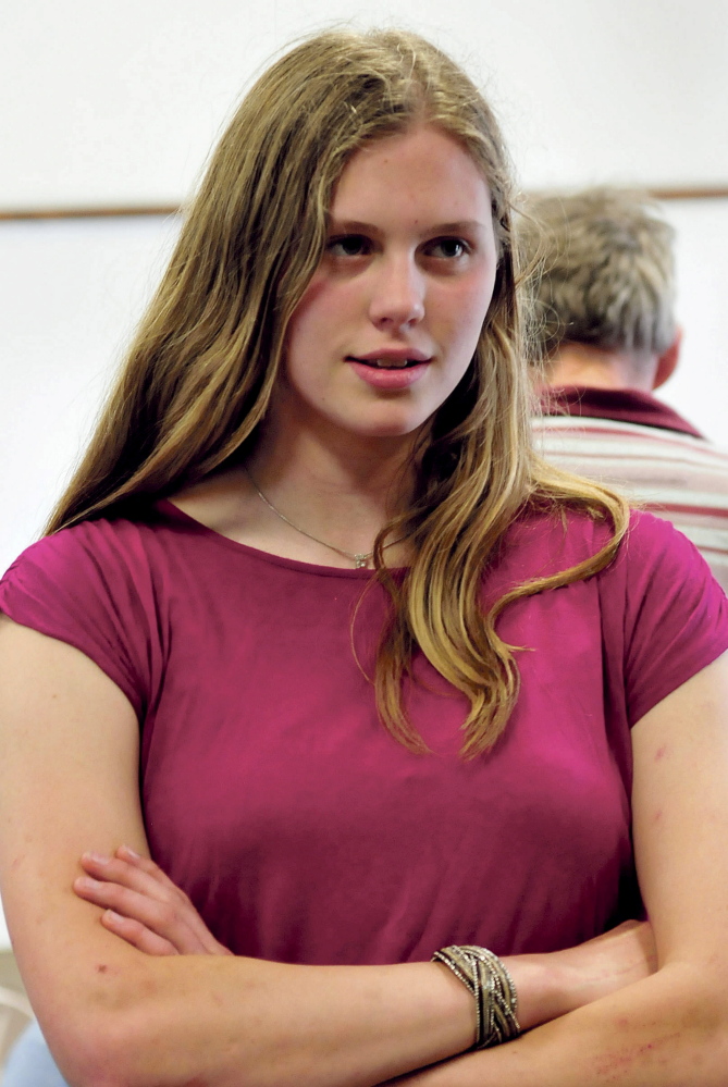 Erskine Academy student Emma Beyor listens as Global Forum speaker Yvonne Davis addresses students Wednesday at the South China school.